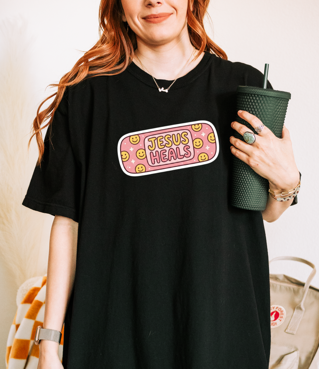 Jesus Heals Bandage Graphic Tee — Cute Christian Faith T‑Shirt